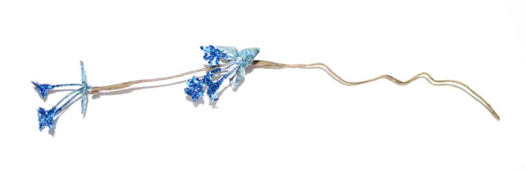 a piece of the blue flower pulled out of the garland