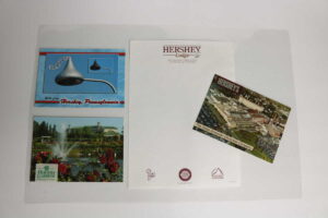 laminated placemat of postcards and stationery