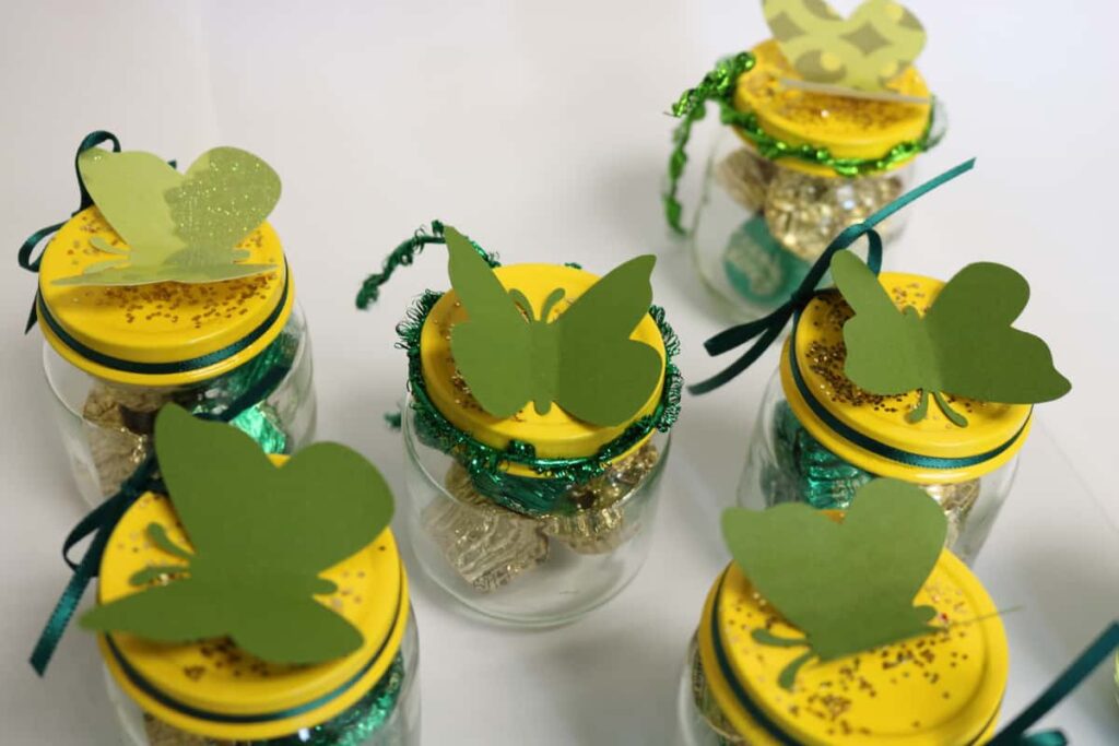 view from the tops of the jars with butterflies on them https://www.b4andafters.com/Baby-Shower-Favors