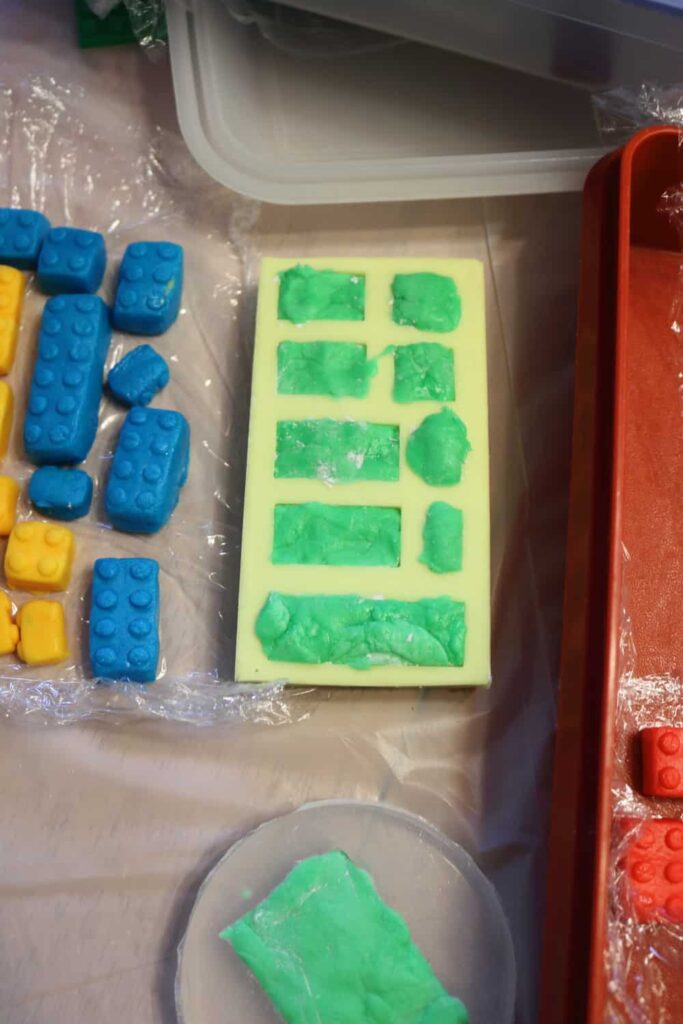 putting the marshmallow fondant in the molds