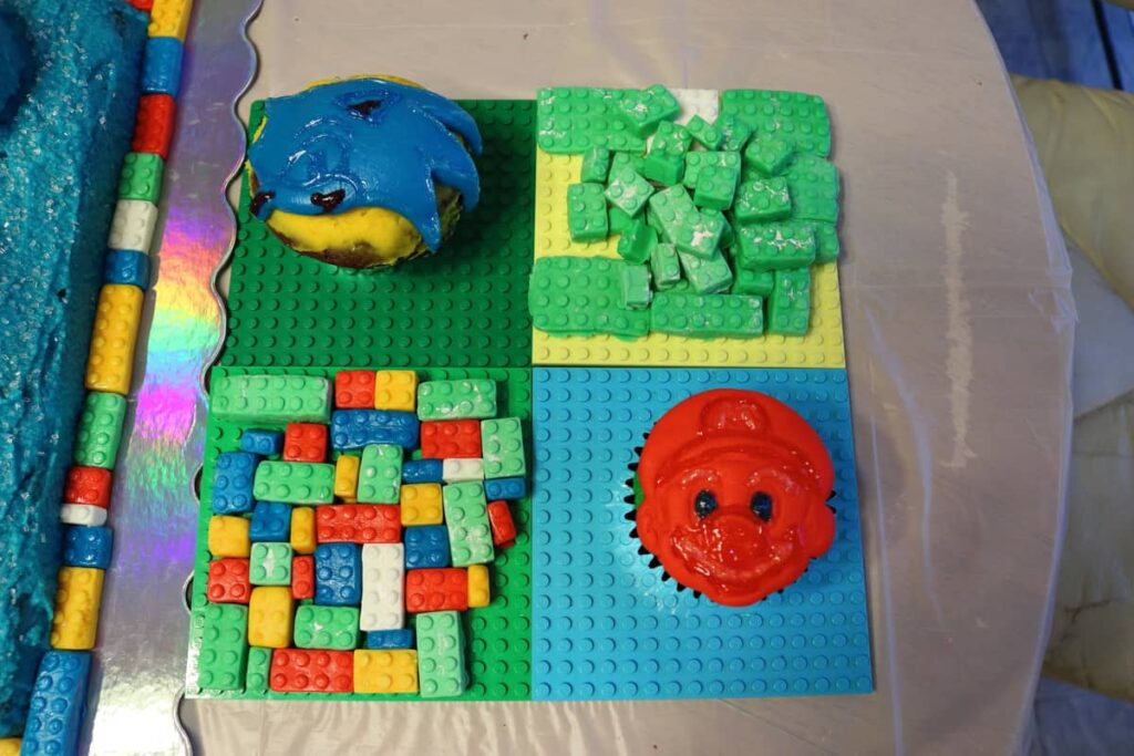 extra fondant lego pieces and sonic cupcake and super mario cupcake