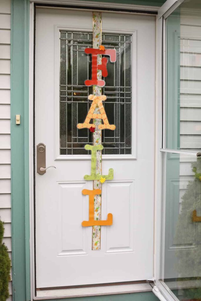 FALL vertically on an outside door attached to ribbon