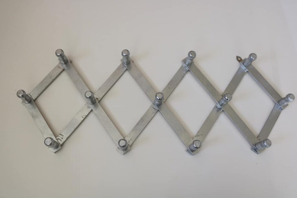wall accordion peg hooks painted silver