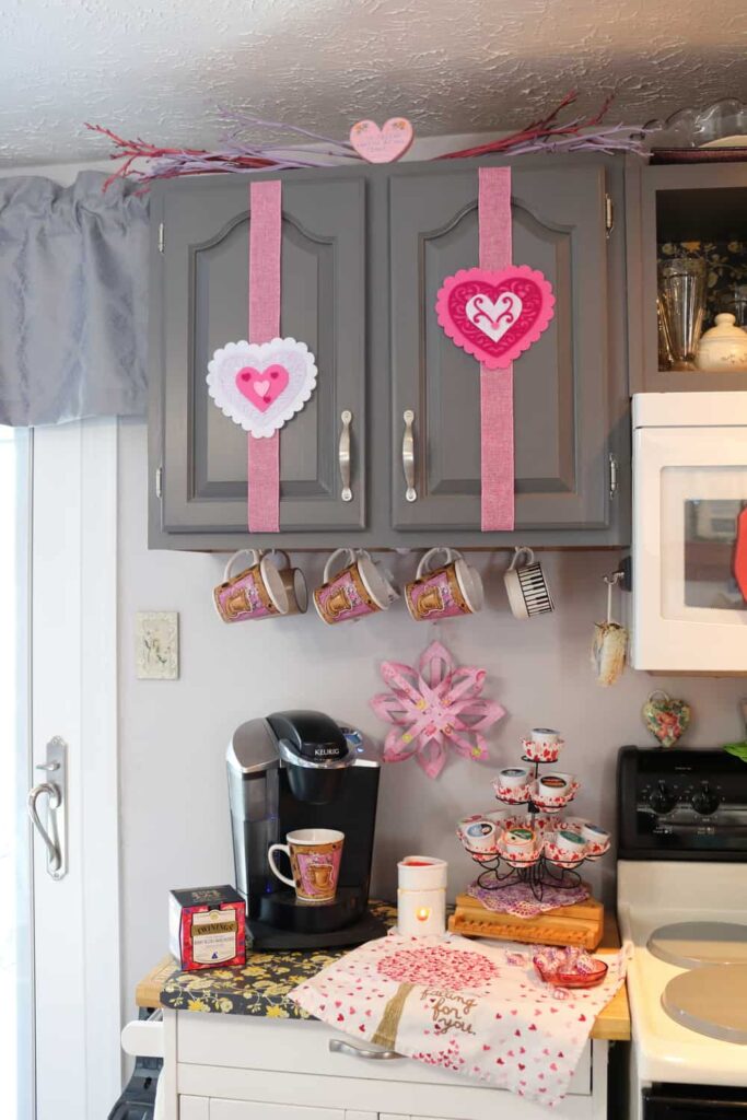 kitchen coffee station with felt hearts decorating the cabinets
