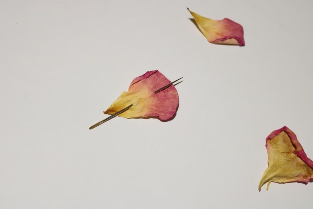 needle with rose petal on it https://www.b4andafters.com/rose-petal-garland