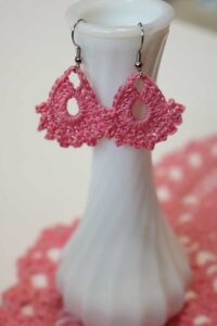 two pink crocheted earrings