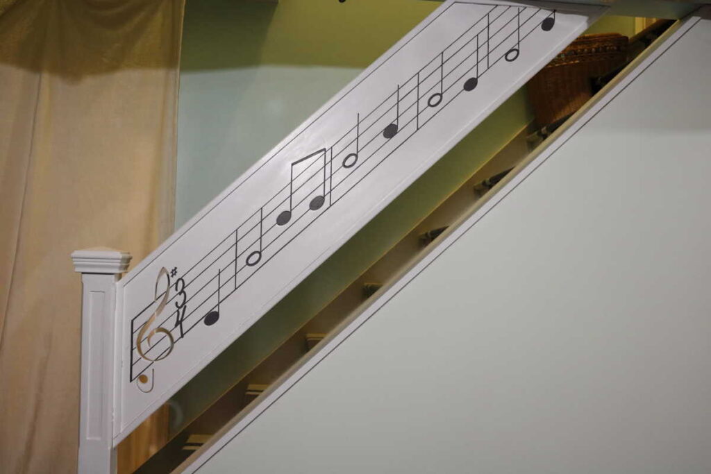 The music railing all painted https://www.b4andafters.com/music-stair-railing