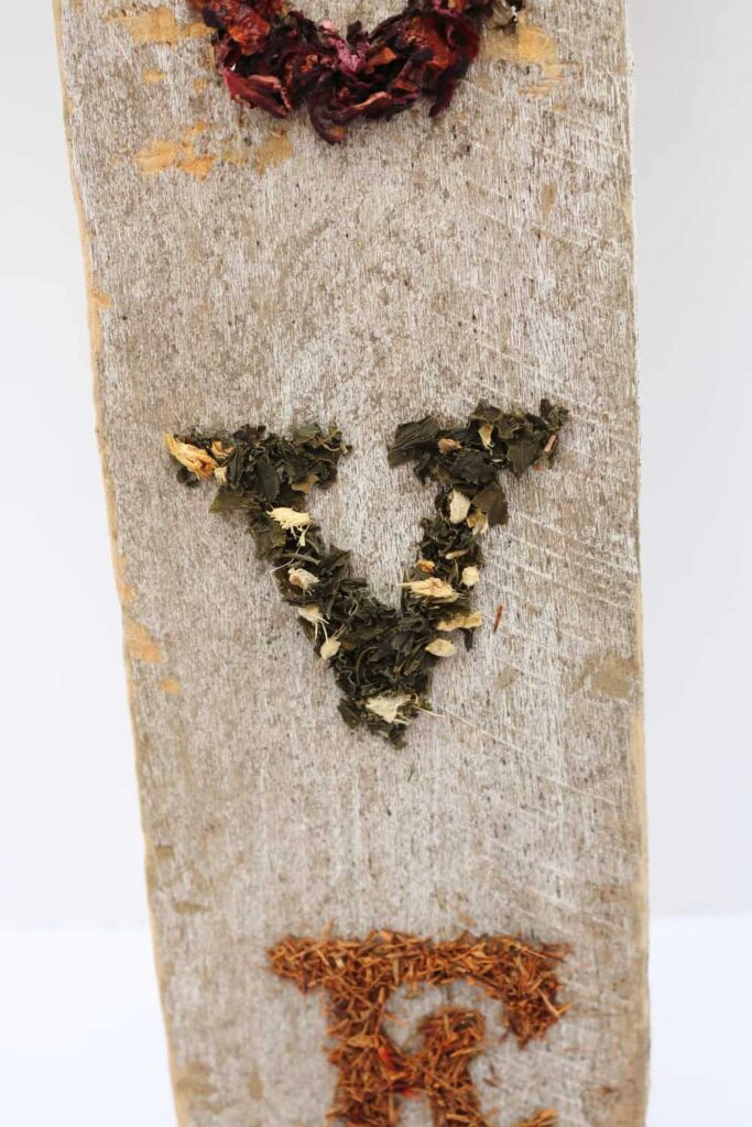 more dried tea leaves in the shapes of letters