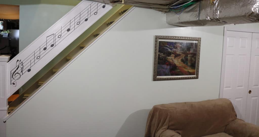 a view of the whole basement wall https://www.b4andafters.com/music-stair-railing