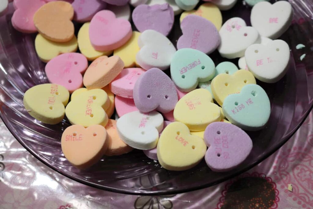 candy hearts with holes drilled into them https://www.b4andafters.com/conversation-heart-garland