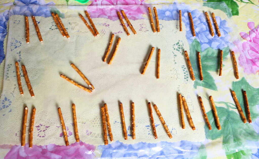 pretzels set out in sets of 2 on wax paper