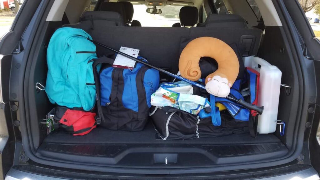 hatchback car trunk with stuff ready to fall out