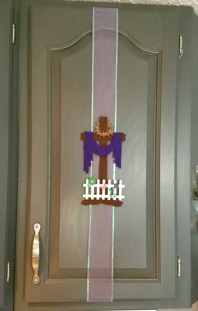 Easter cross on cupboard door