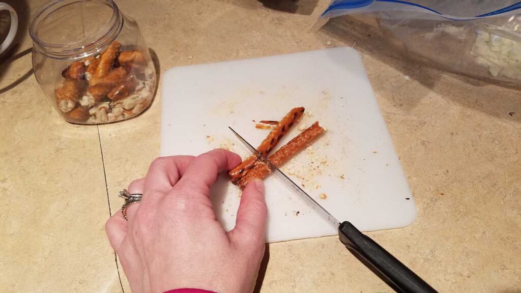 cutting two pretzels