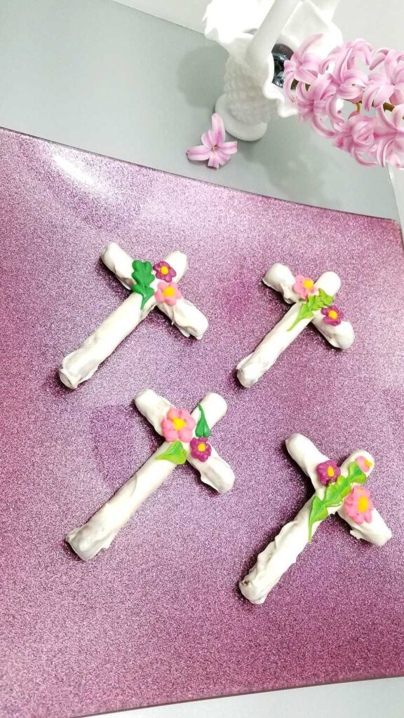 beautiful white chocolate covered pretzel crosses embellished with leaves and flowers
