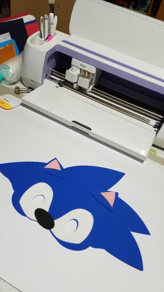 sonic face shape with Cricut machine in background