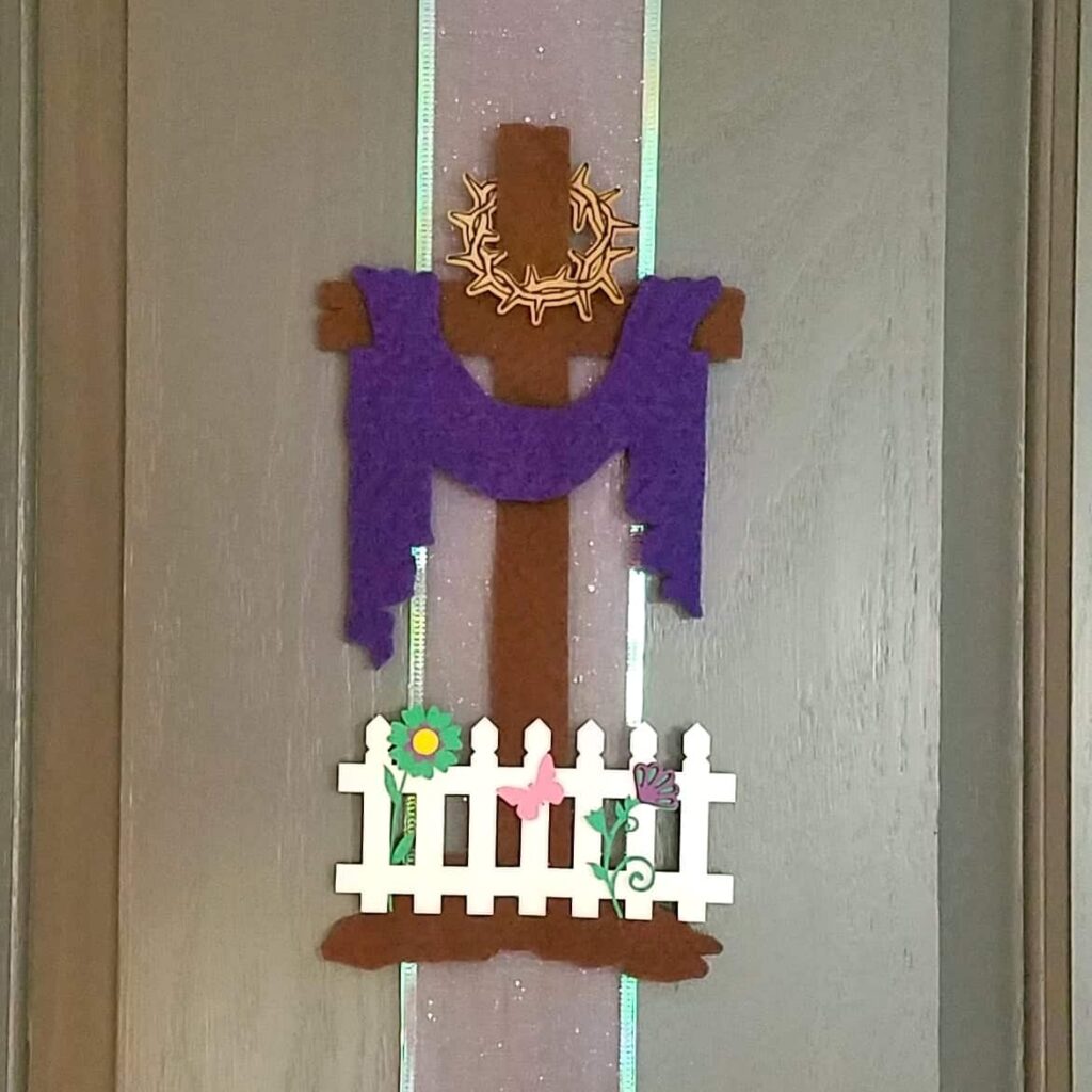 closeup of Easter cross with crown of thorns