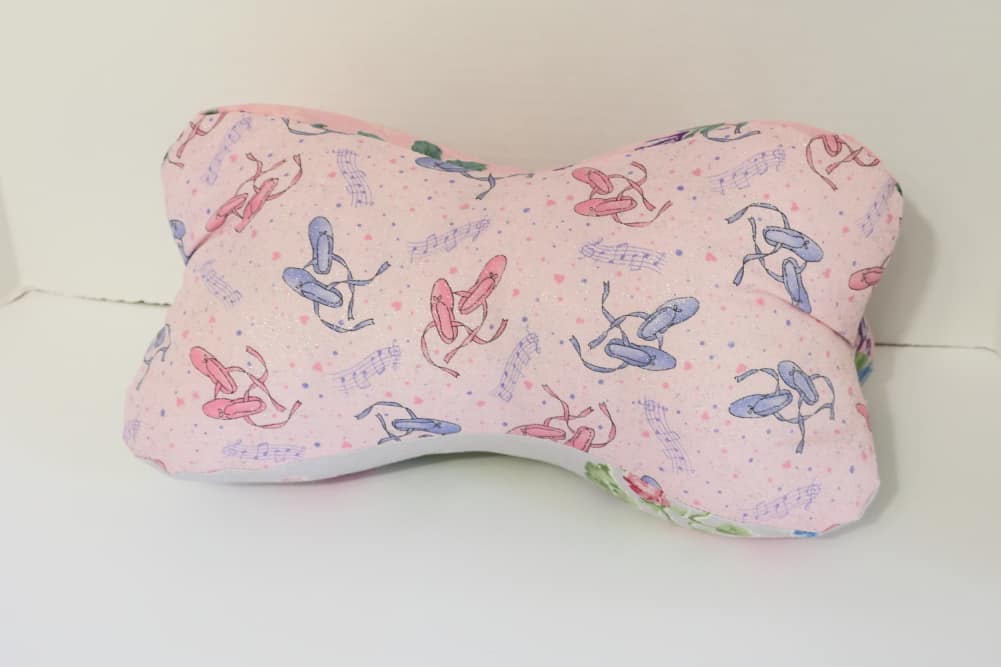 pink bone shaped pillow