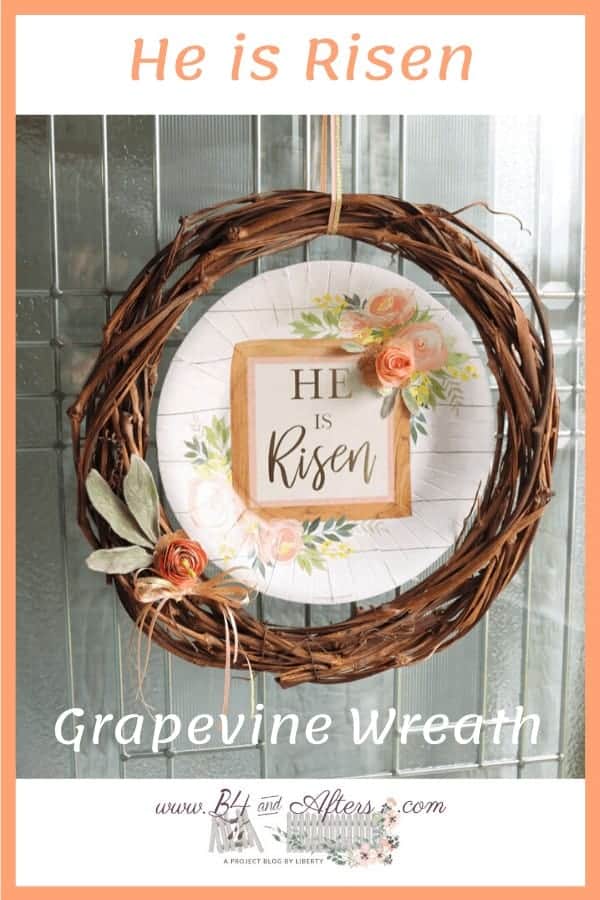 grapevine wreath with He Is Risen paper plate in the center