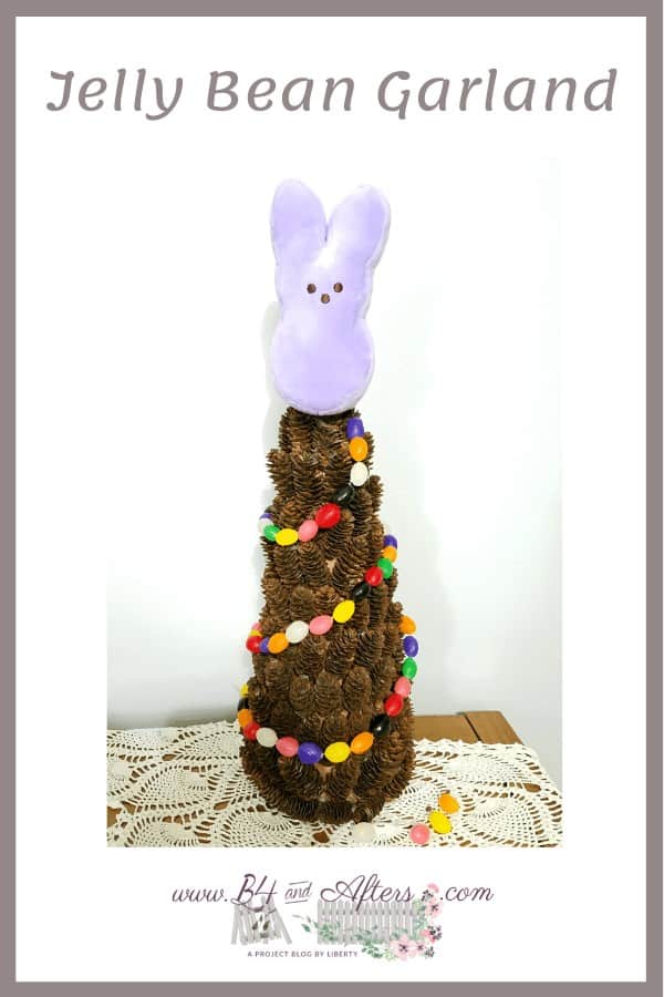 Jelly bean garland on a pine cone tree with a plush bunny Peep as a tree topper