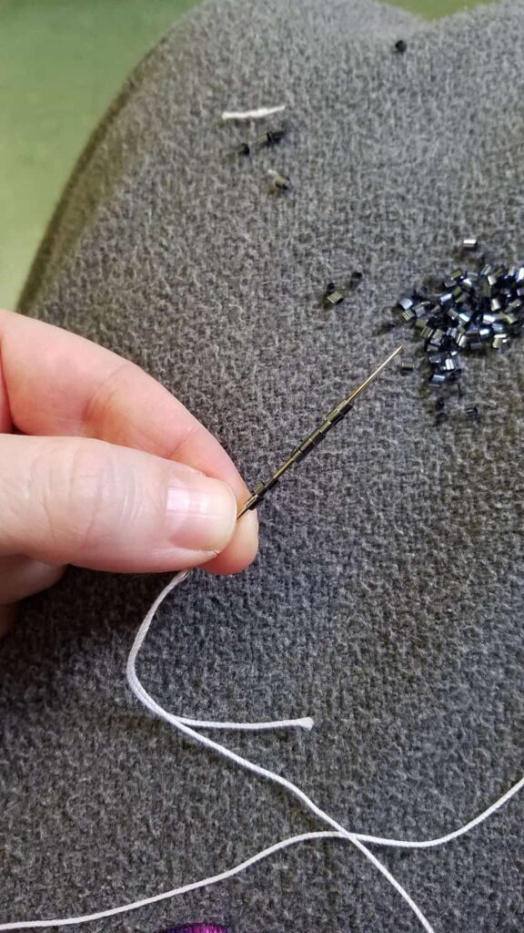 putting pewter confetti on a needle