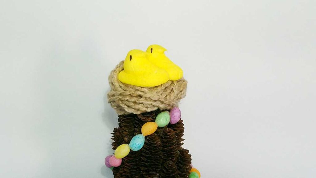 yellow marshmallow chick Peeps on a yarn nest