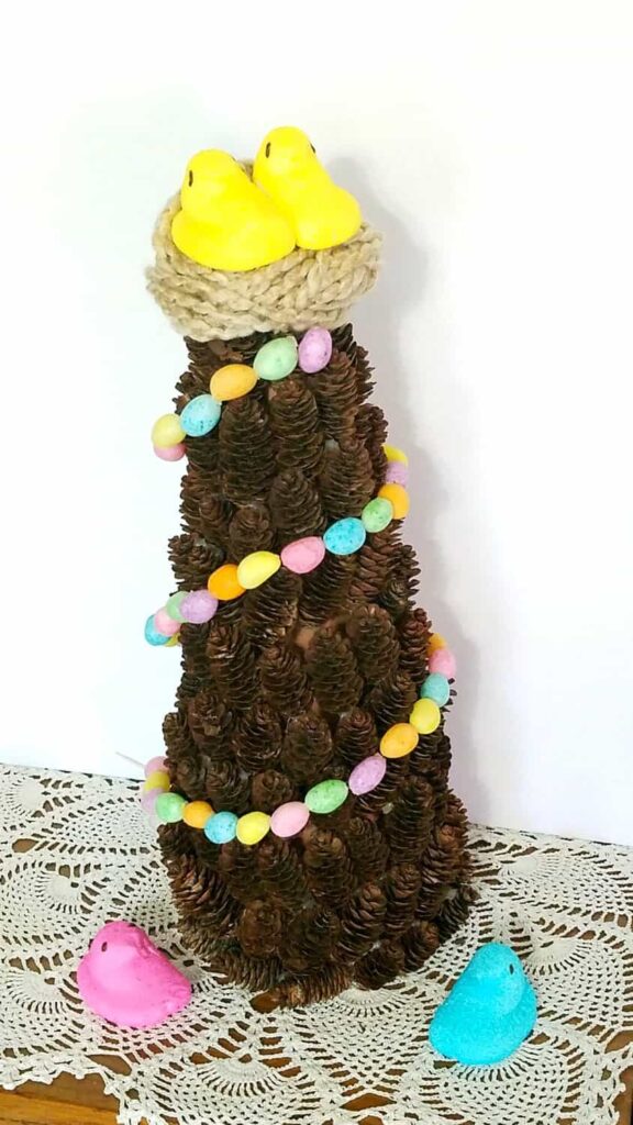 Jelly bean garland on a pine cone tree with yellow Peeps topper