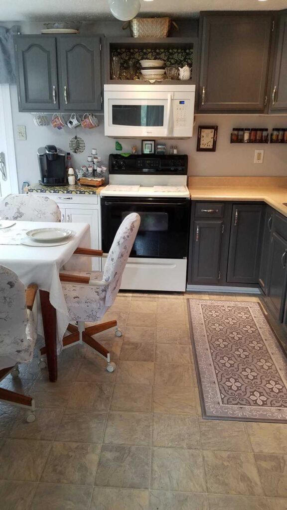 kitchen showing microwave and oven wall