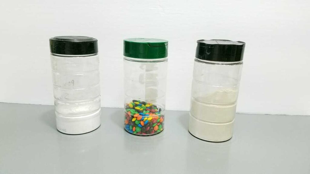 powdered sugar, M+Ms, flour in clear containers