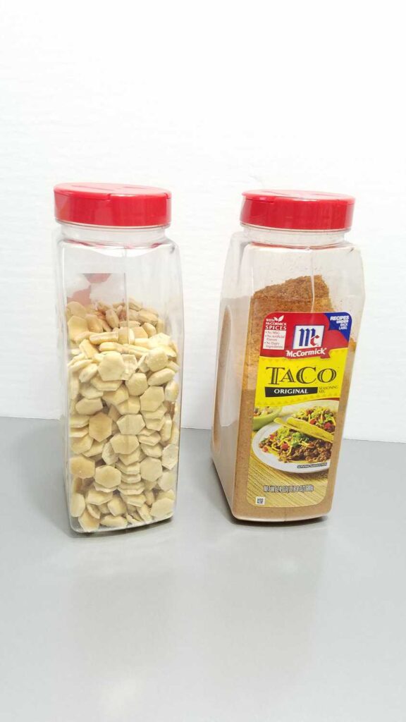 oyster crackers next to a large Taco Seasoning container