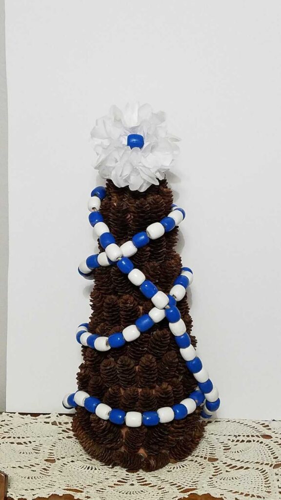 blue and white wood bead garland pine cone tree