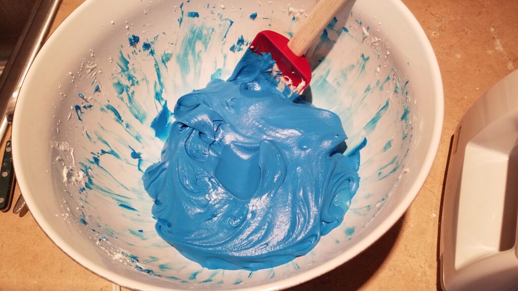 bowl of bright blue cake batter