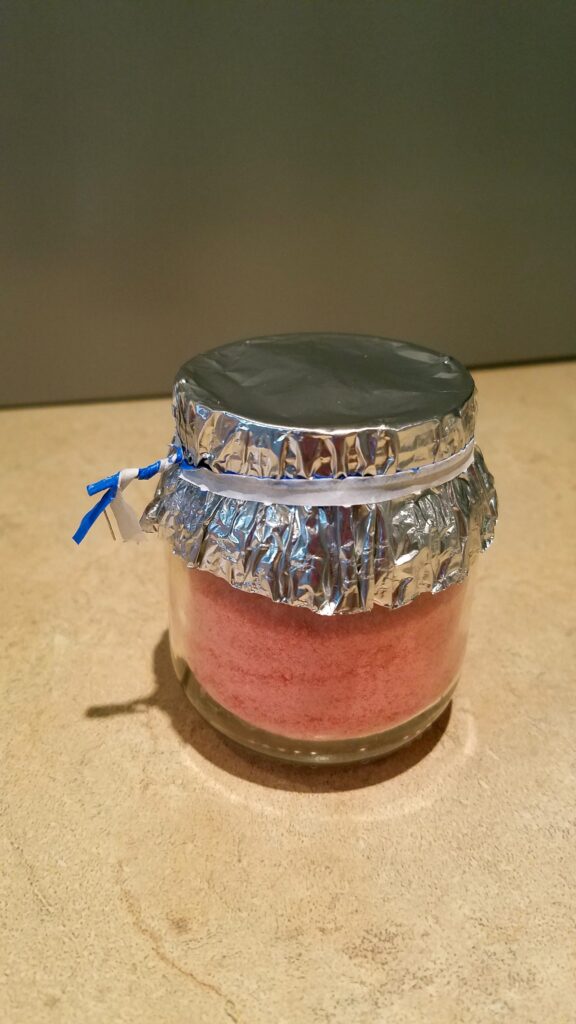 twisty tied holding foil onto jar