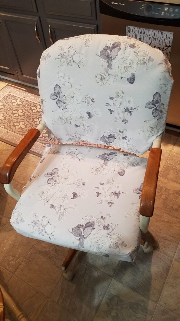 slipcovered kitchen chair with gray and white floral fabric