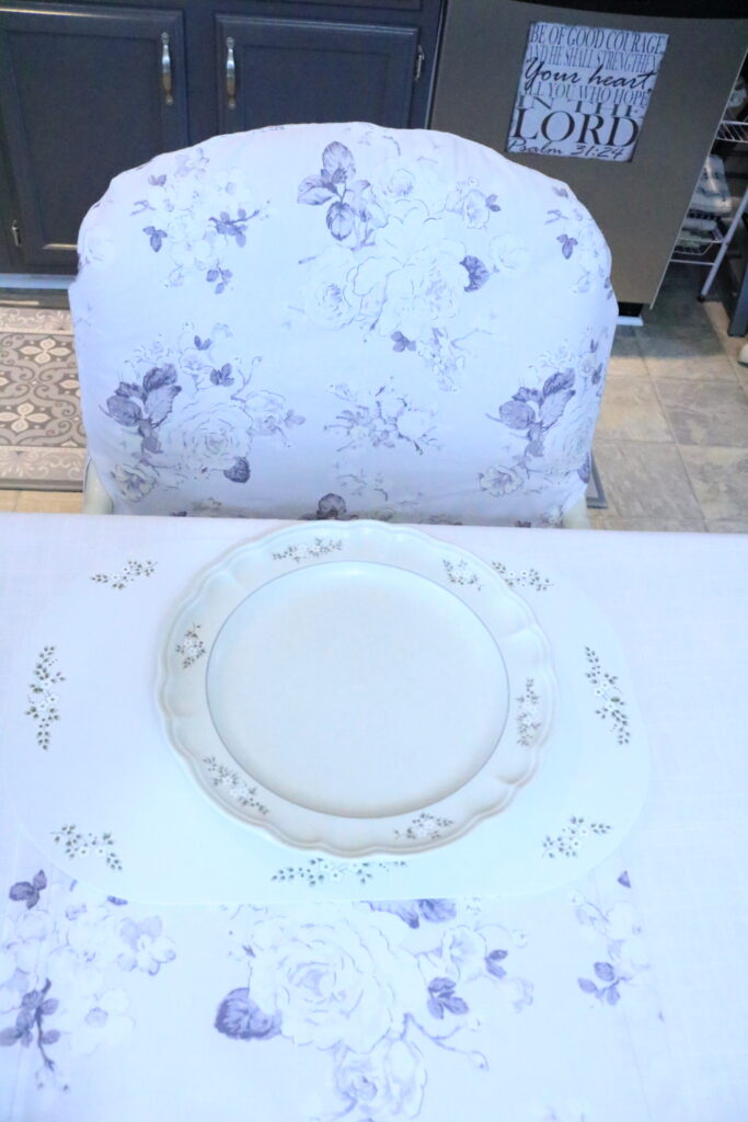 slip covered chair at table setting with coordinating plate