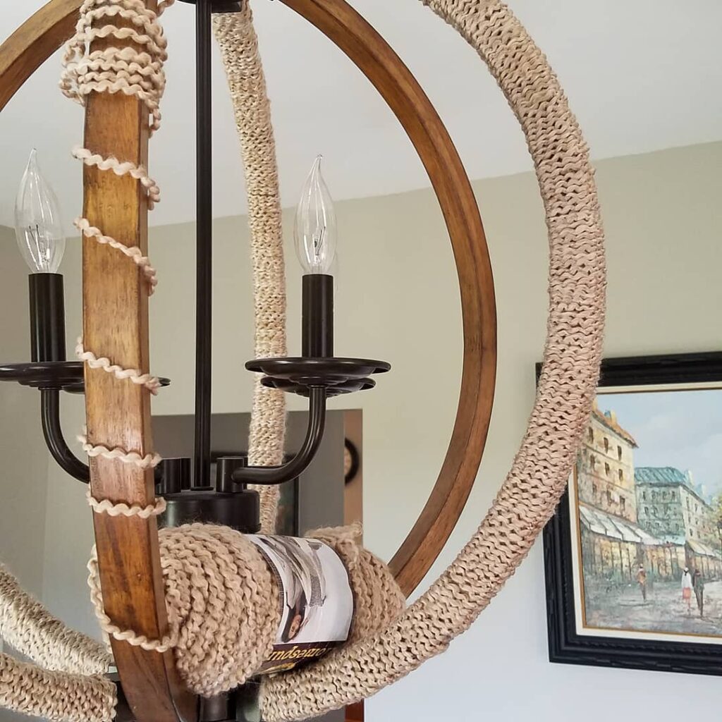 yarn partially wrapped around chandelier