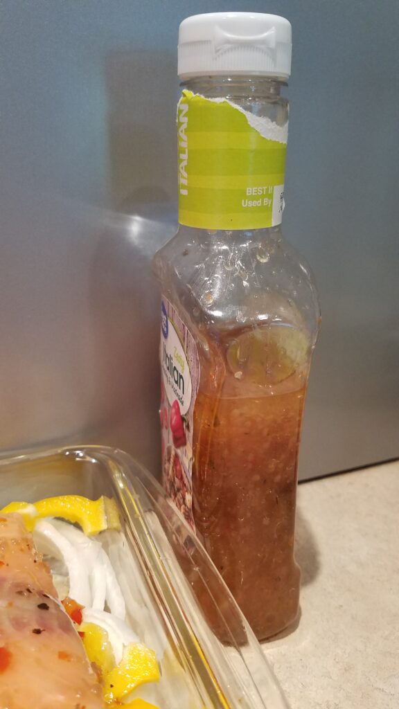 bottle of Italian dressing partially empty