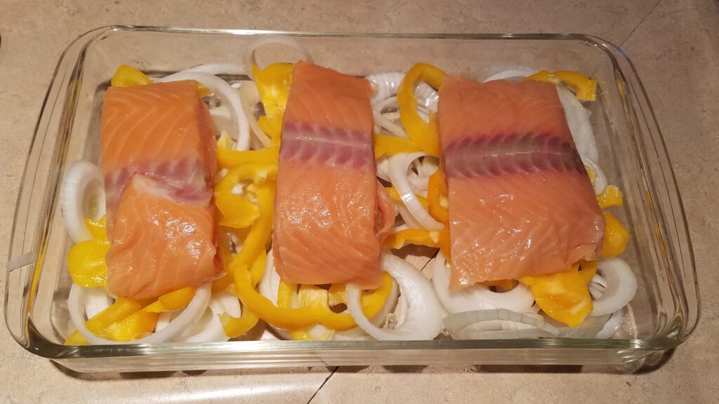 raw salmon, yellow bell peppers, and onions