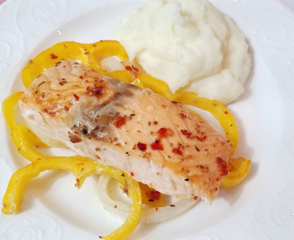 plated salmon with yellow bell peppers and mashed potatoes