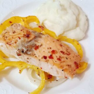 plated salmon with yellow bell peppers and mashed potatoes