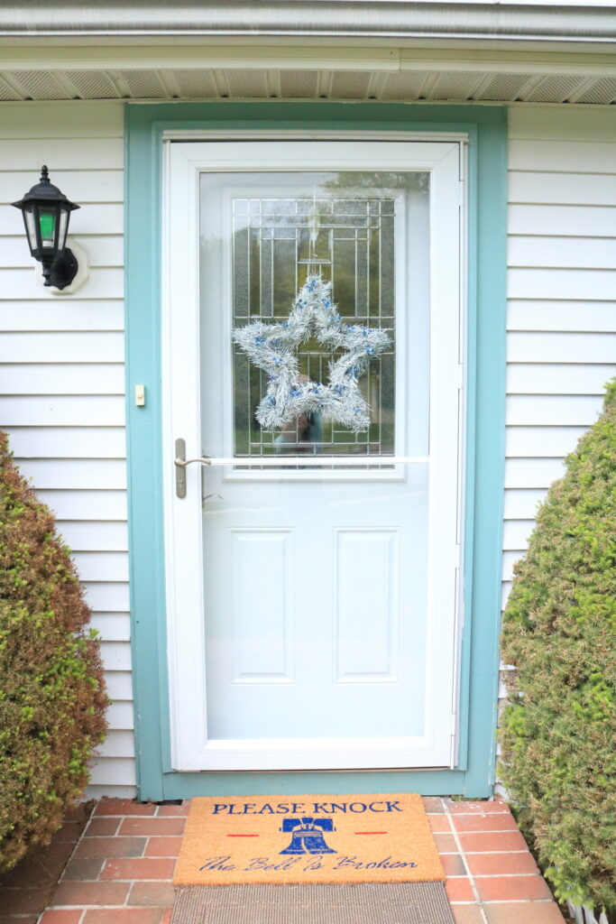 Patriotic Door with white star wreath and Liberty Bell doormat