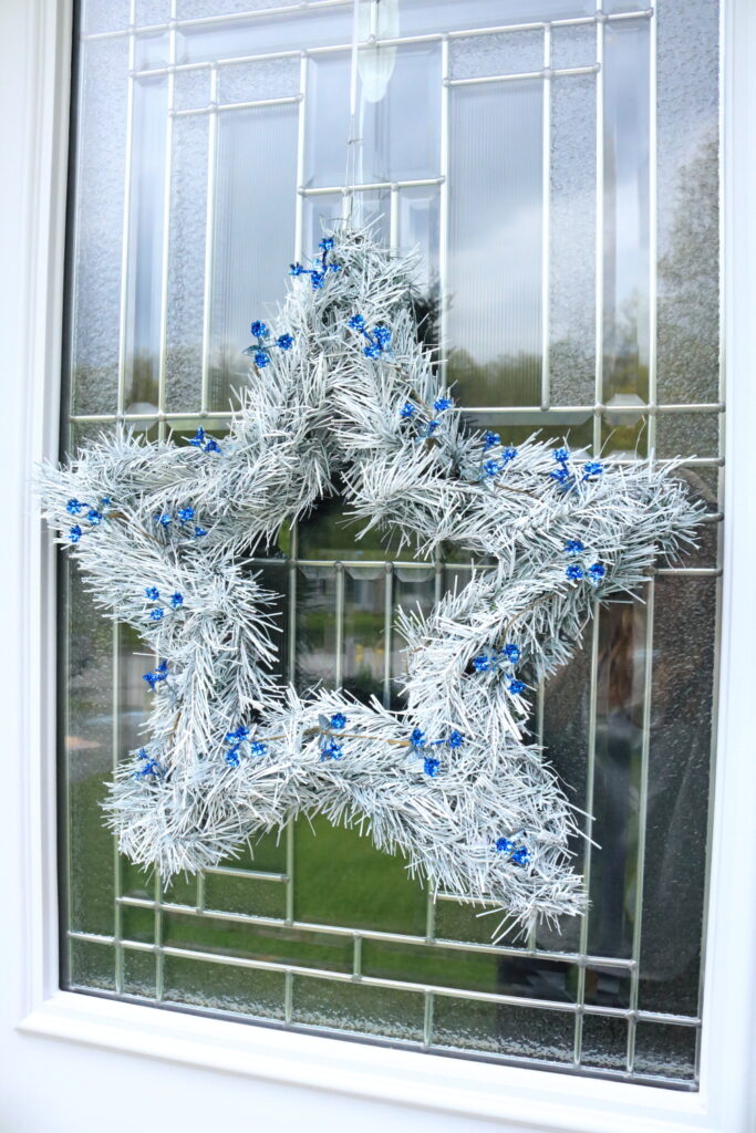 white 5 point star wreath with blue accents