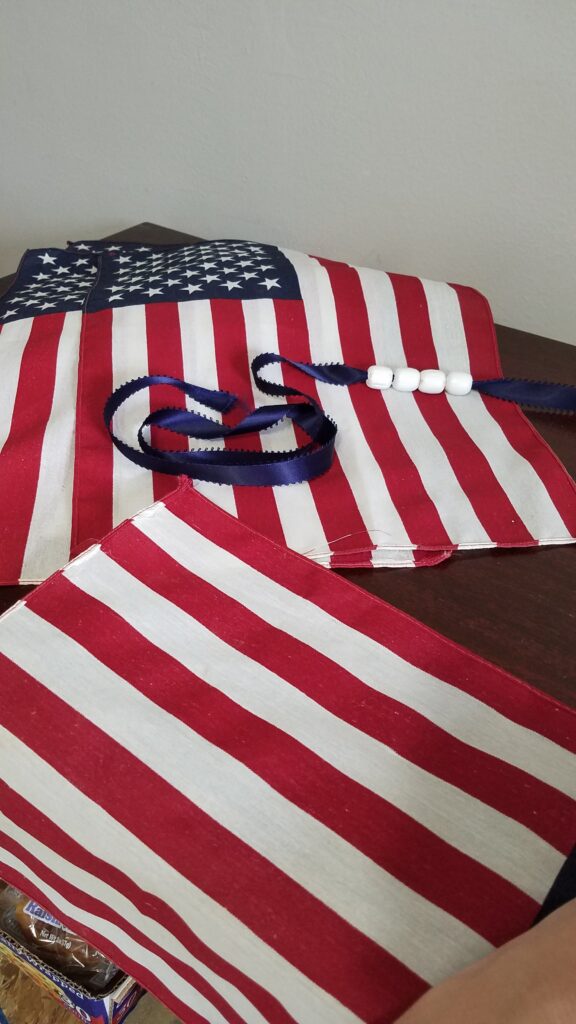 flags, ribbon with white wooden beads on the ribbon