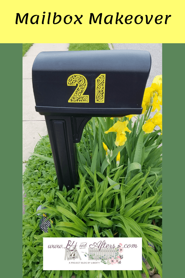 black mailbox with custom yellow numbers on it