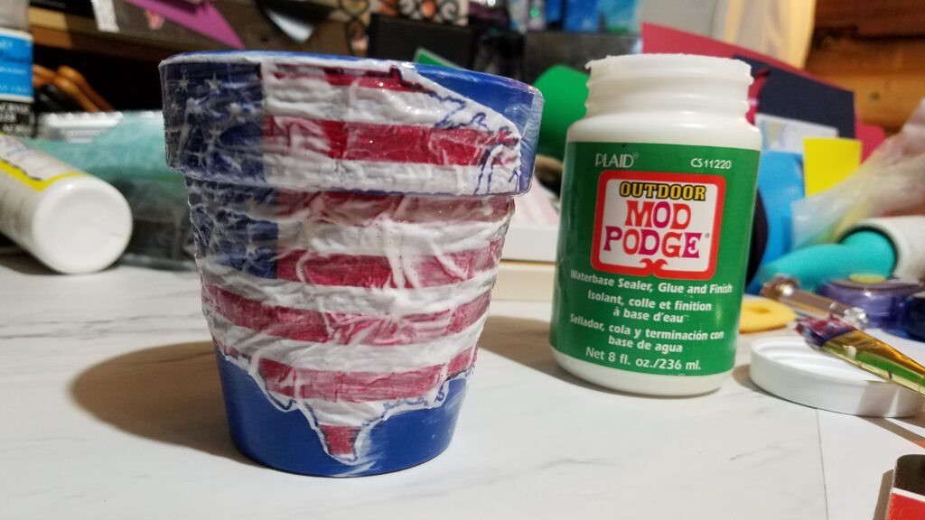 wet mod podge all over United States napkin on pot