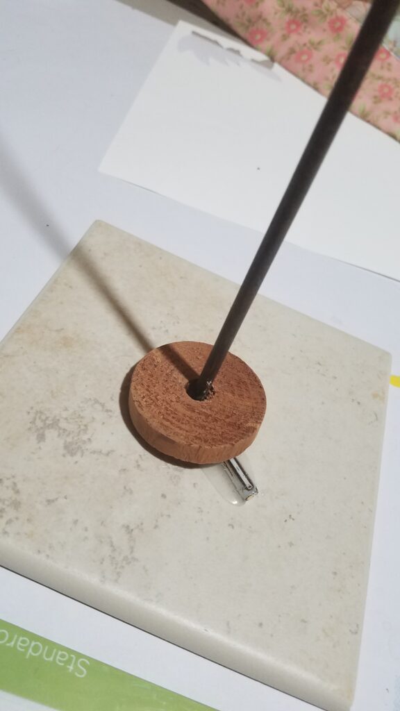 wooden circle on metal stake for stability