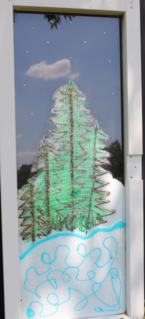 evergreens painted on window