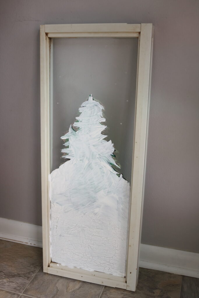 back of winter window scene that is painted white