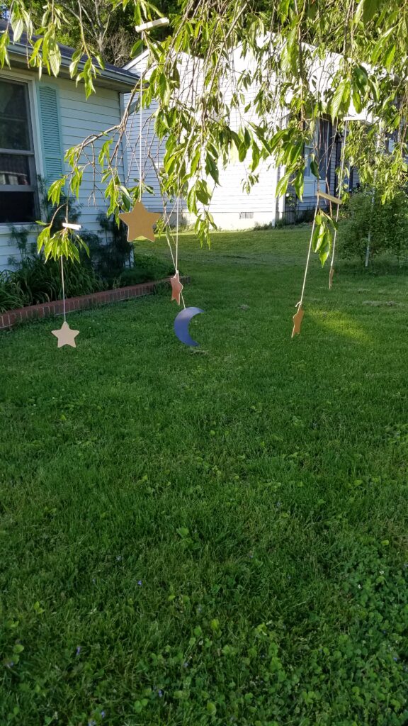 stars and moons hanging from a tree