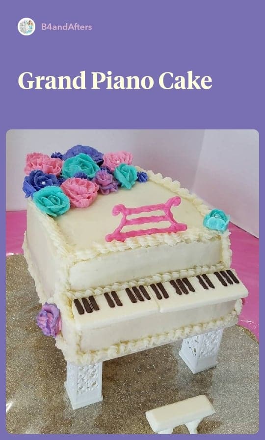 white grand piano cake with pink, purple, and teal flowers